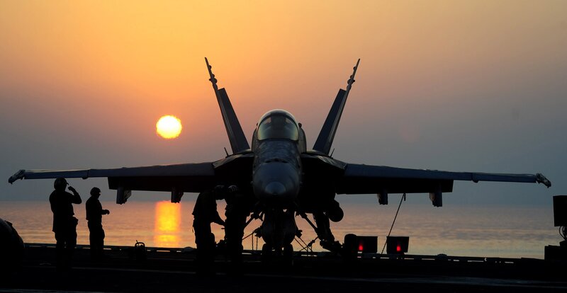 Fighter Jet on Aircraft Carrier — Orange, Dramatic, Sunset, Photograph, Personnel