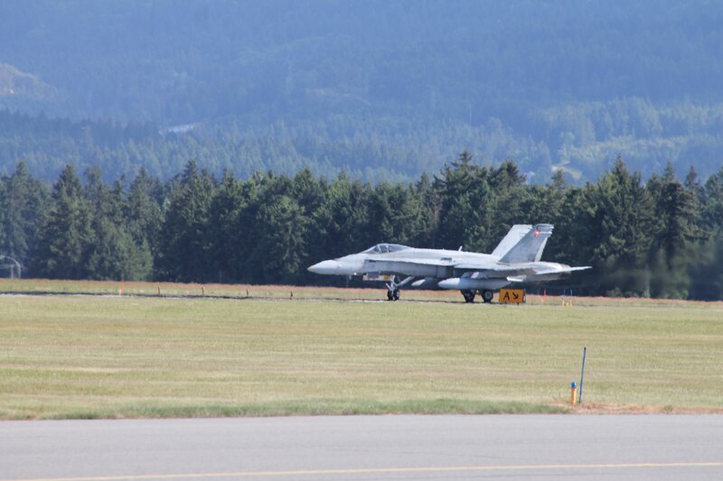 Fighter Jet on Runway — Green, Calm