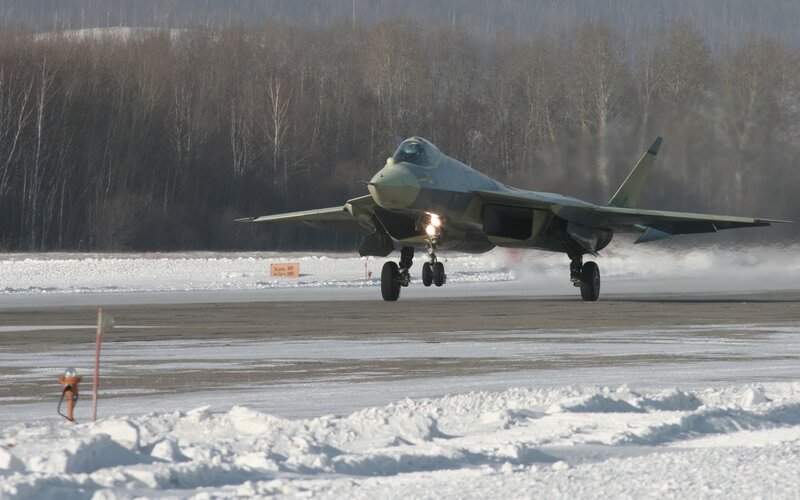 Fighter jet on snowy runway