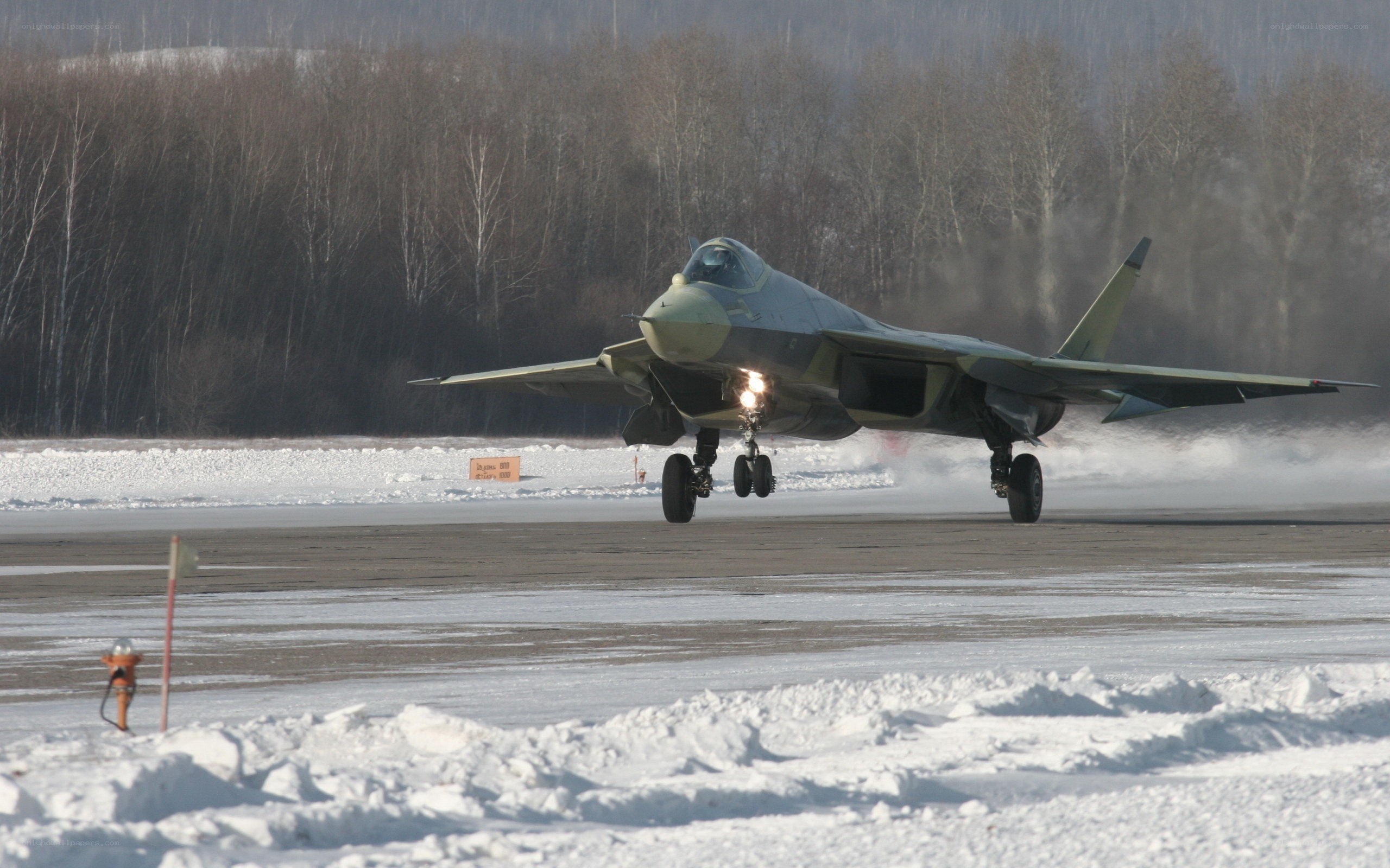Fighter jet on snowy runway