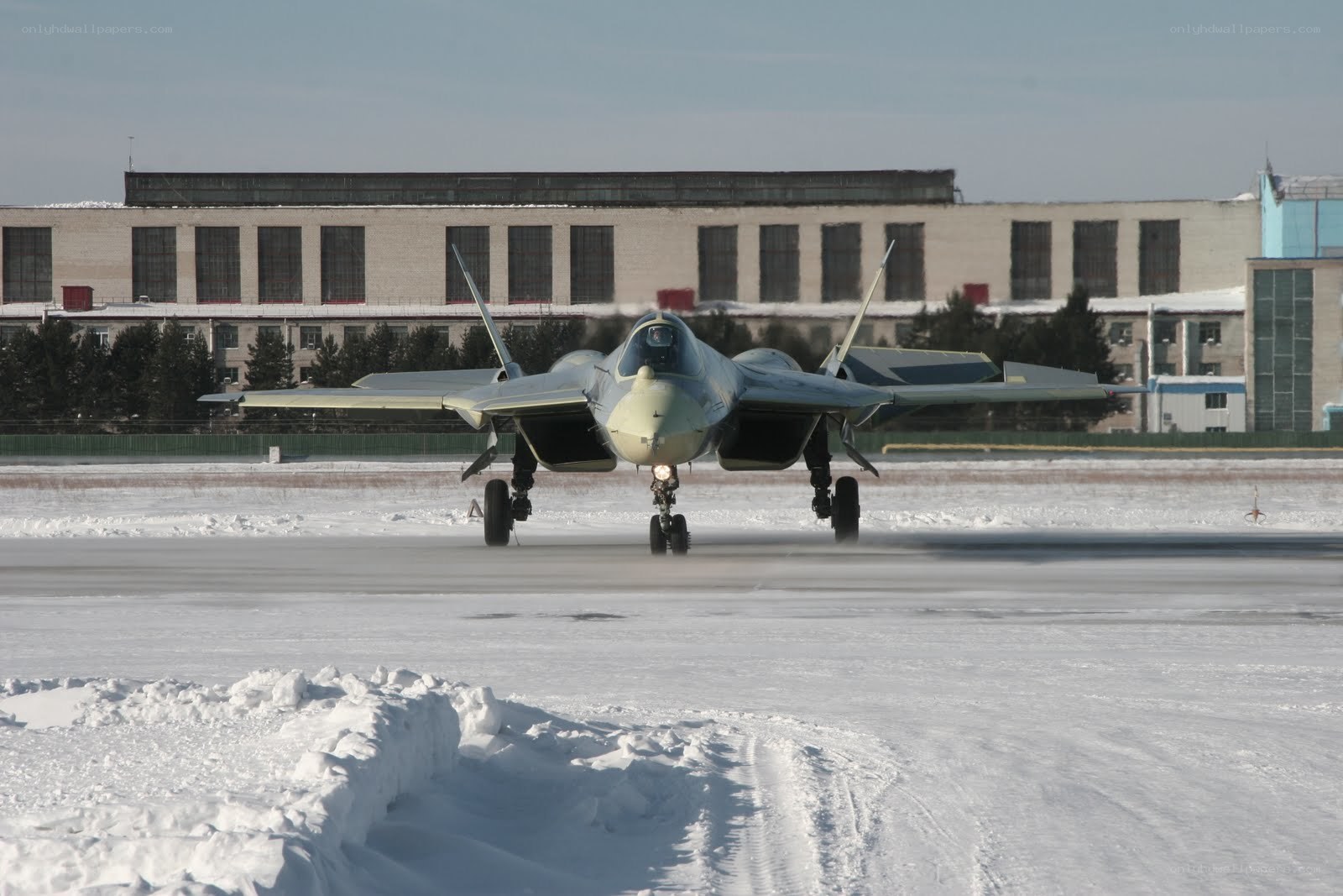 Fighter jet on snowy runway