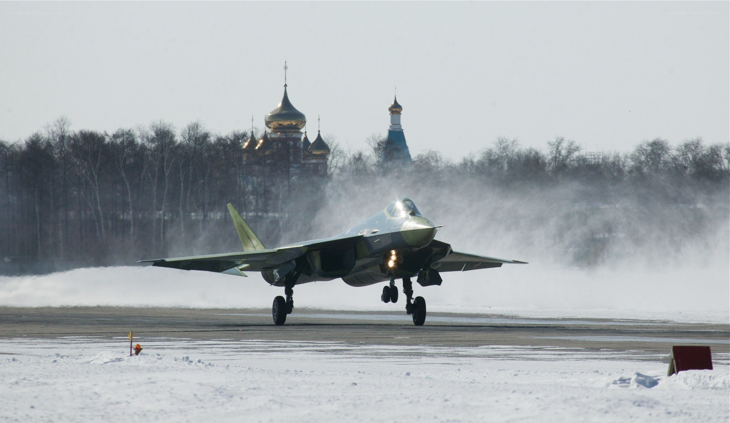 Fighter jet on snowy runway