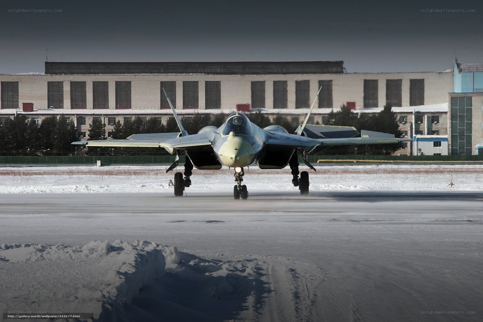 fighter jet on snowy runway
