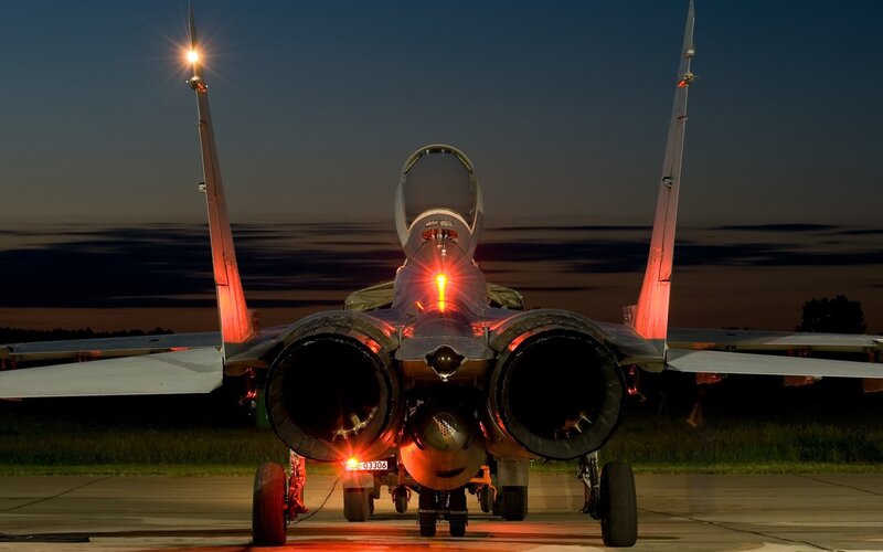 Fighter jet on tarmac at dusk
