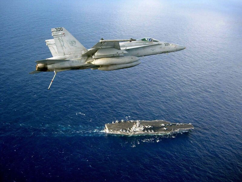 Fighter Jet over Aircraft Carrier — Blue