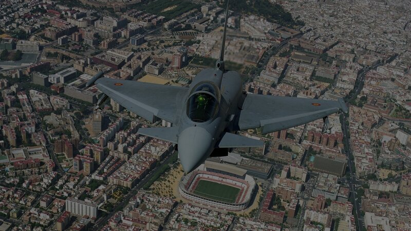fighter jet over city