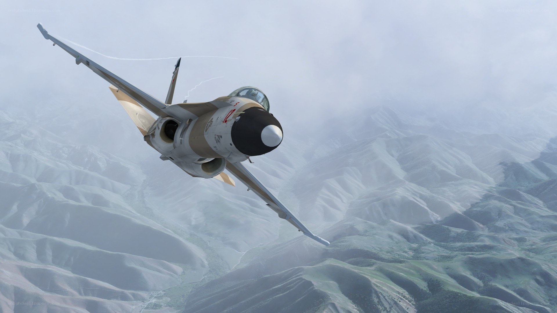 fighter jet over mountainous terrain