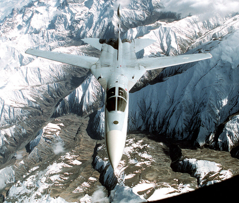 Fighter Jet over Mountains — White, Dramatic