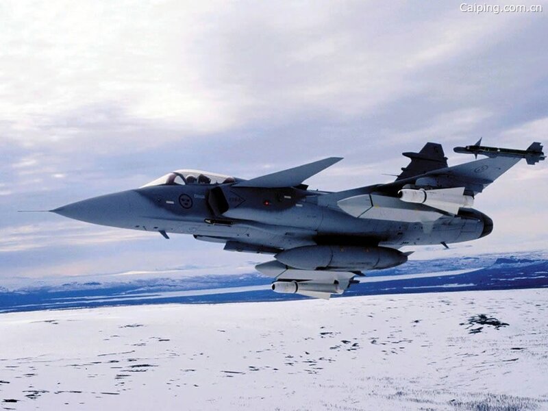 fighter jet over snowy landscape