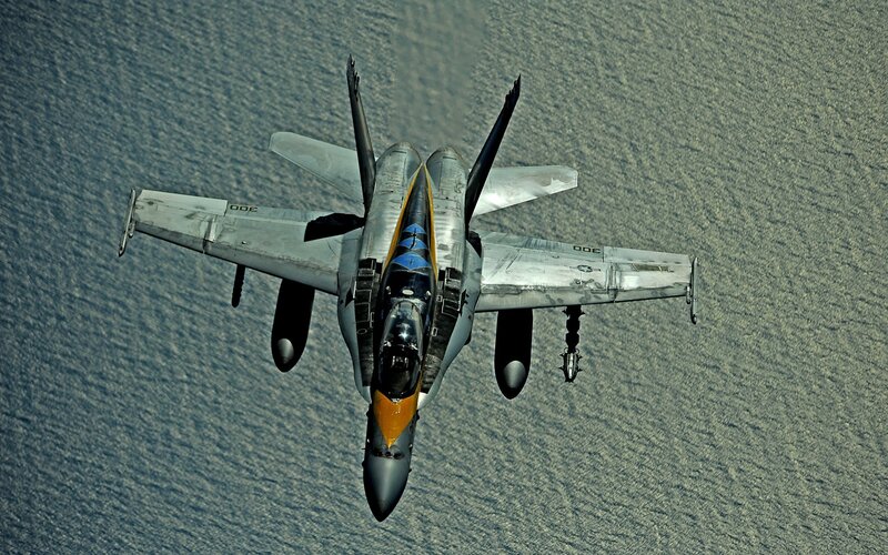 fighter jet over water
