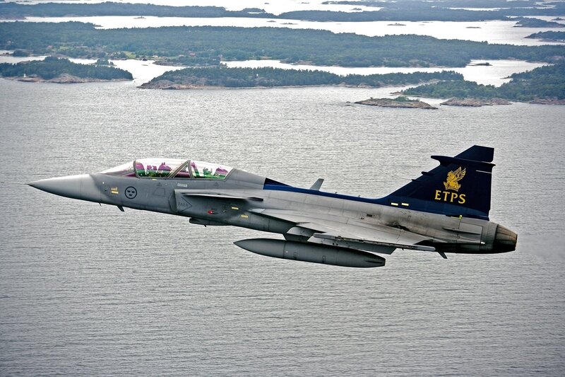 Fighter Jet over Water — Gray, Aerial, Afternoon