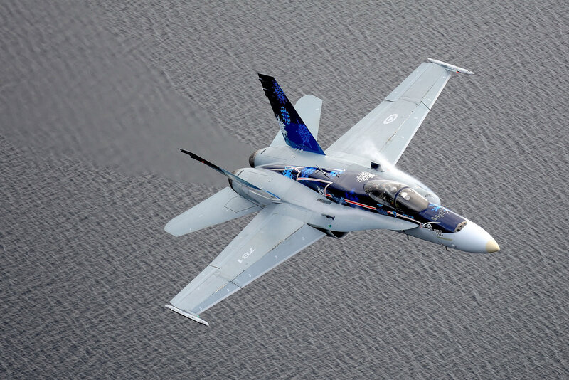 fighter jet over water