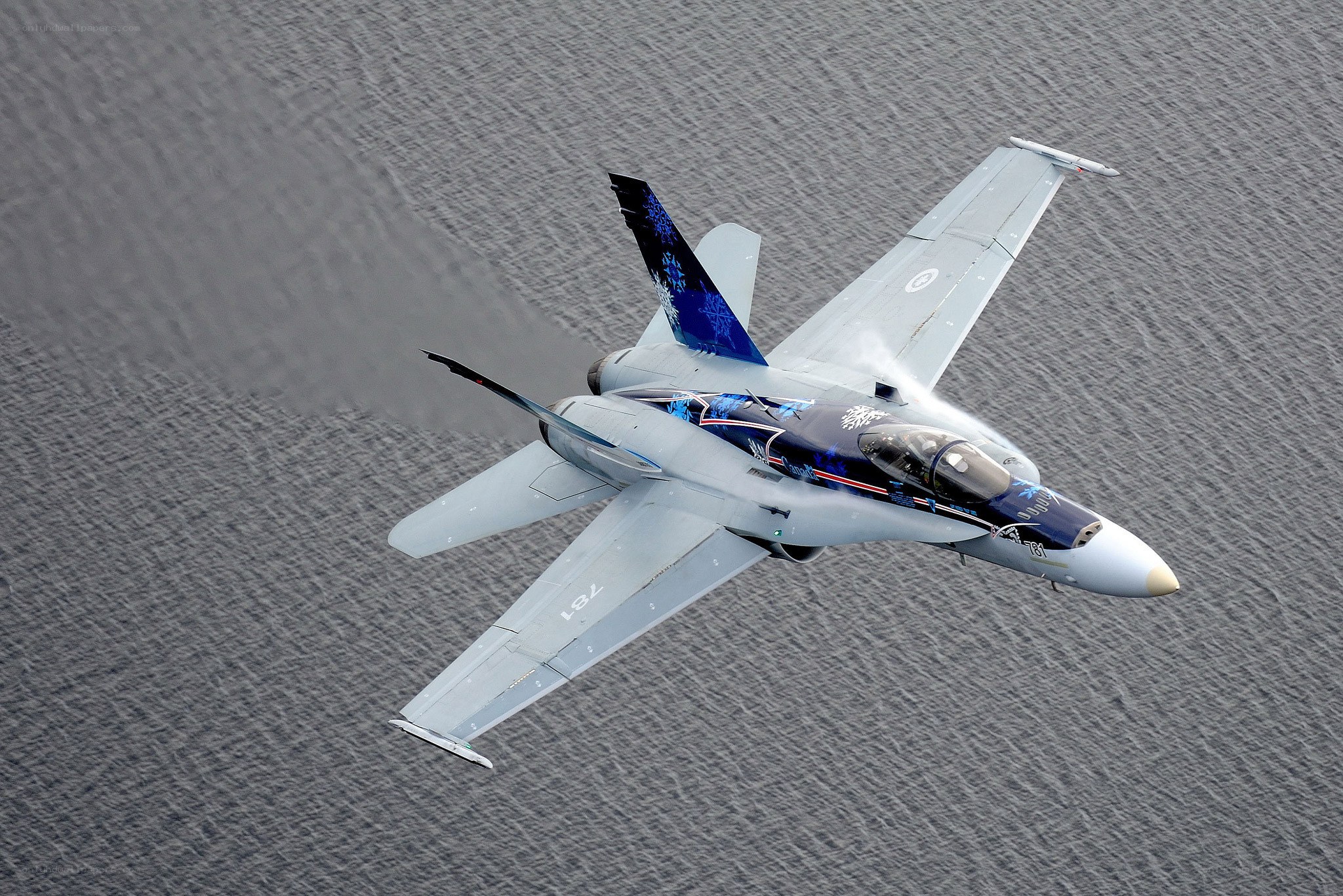 fighter jet over water