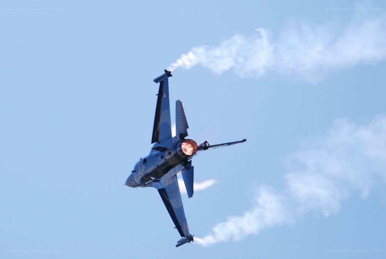 fighter jet performing aerobatic maneuver