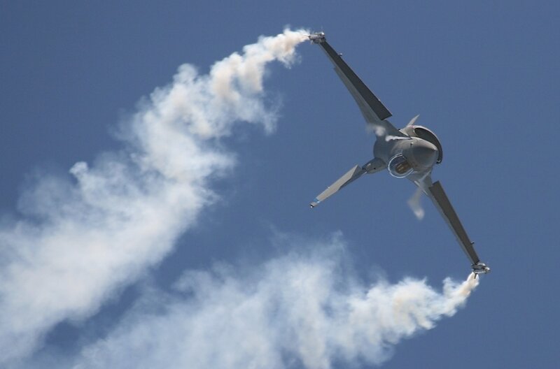 Fighter Jet Performing Aerobatics — Blue
