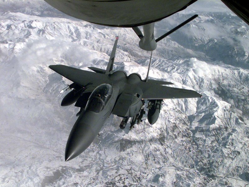 Fighter jet refueling over mountains