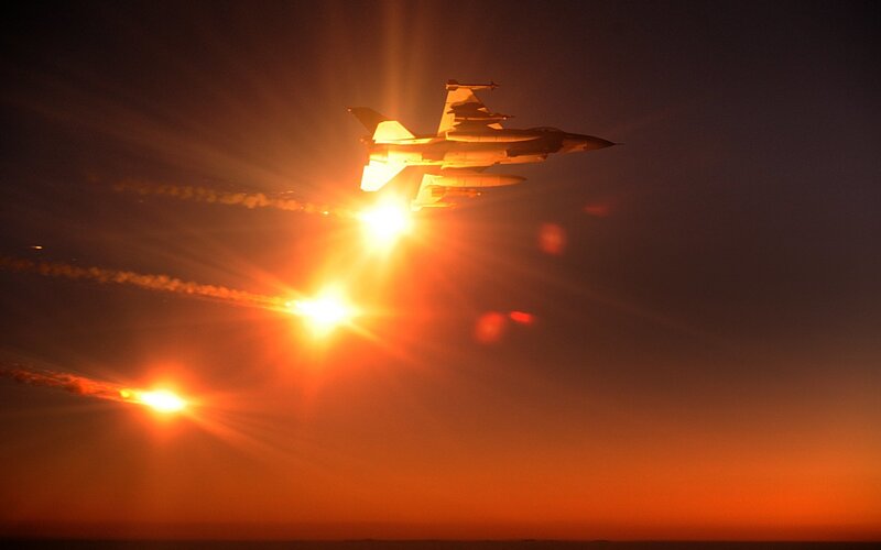 Fighter Jet Releasing Flares — Orange