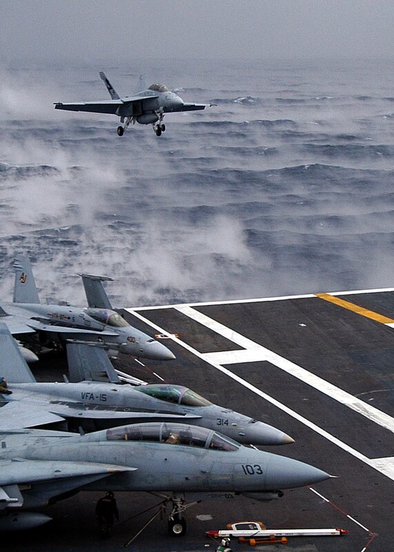 Fighter jet taking off from aircraft carrier