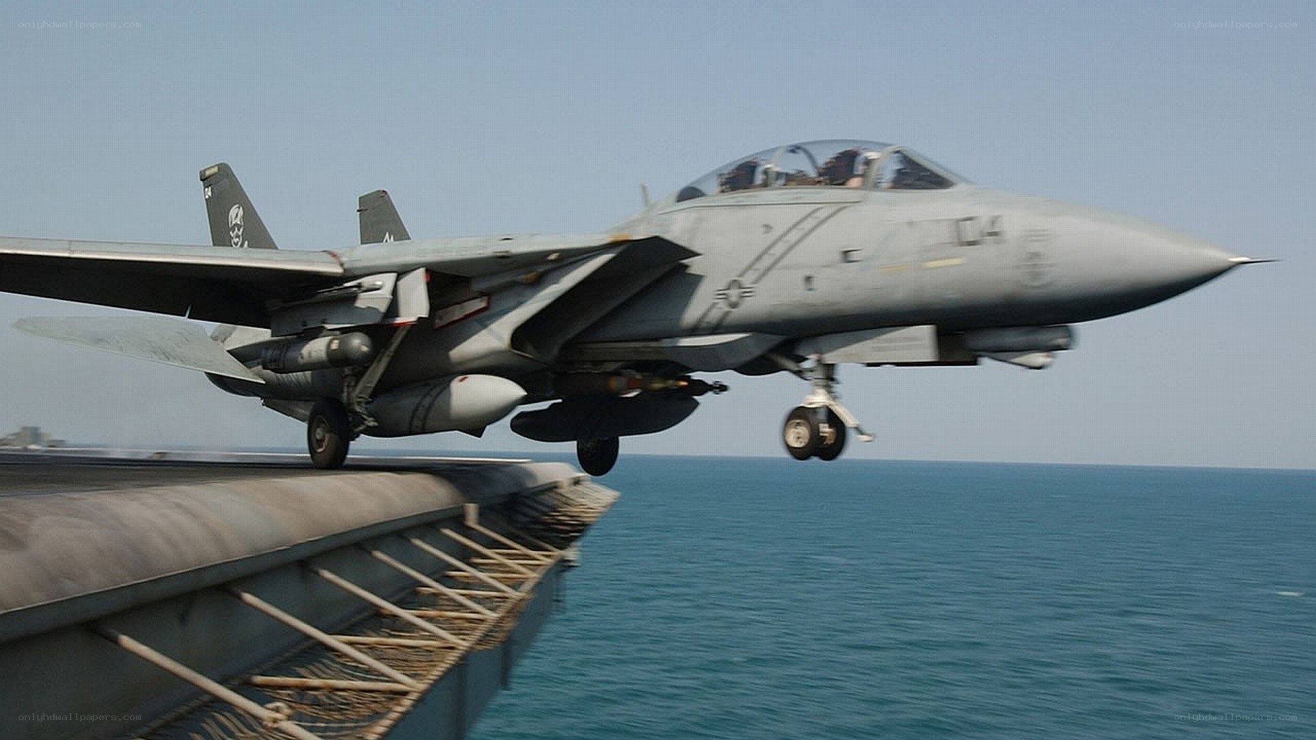 fighter jet taking off from aircraft carrier