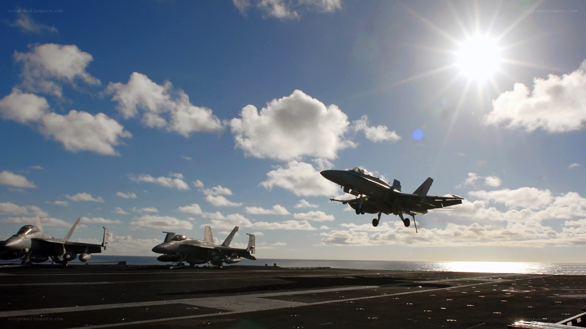 Fighter jet taking off from aircraft carrier