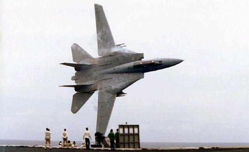 fighter jet taking off from aircraft carrier