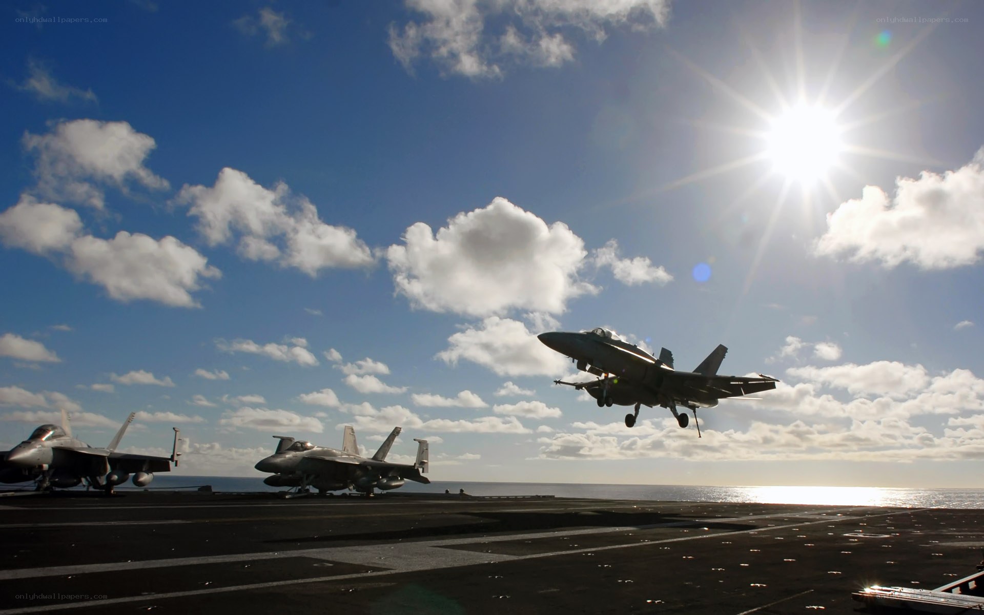 Fighter jet taking off from aircraft carrier