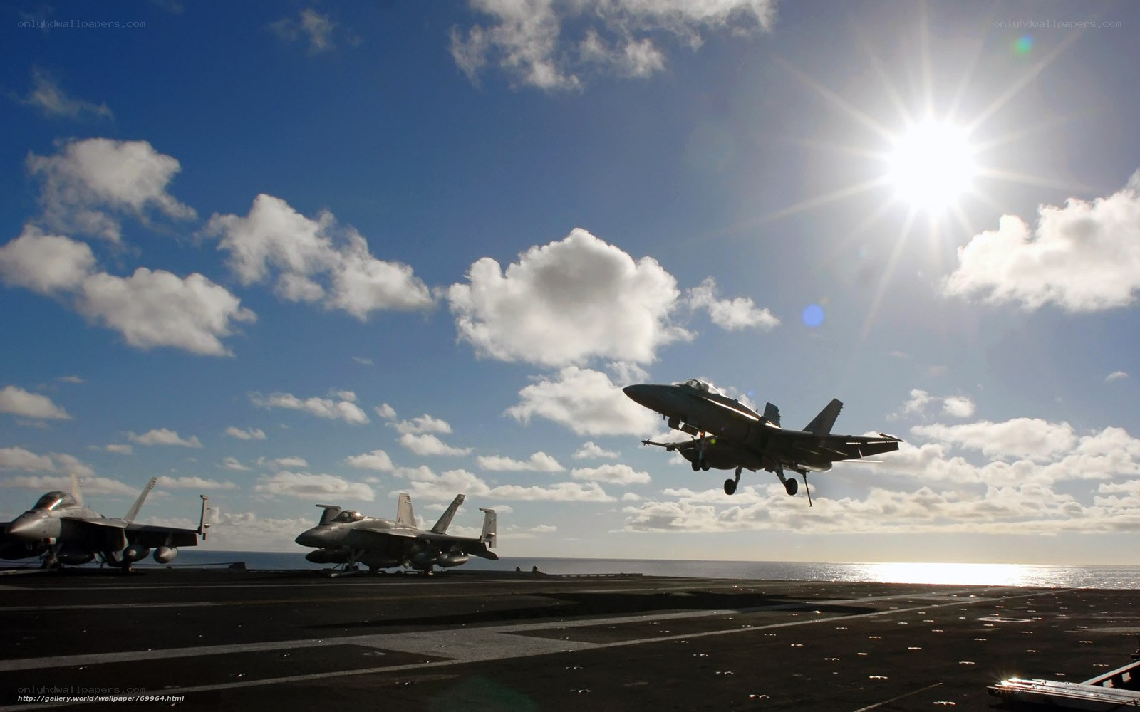 Fighter jet taking off from aircraft carrier