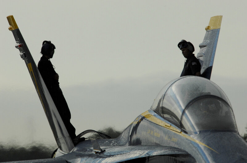 Fighter jet with crew on wings