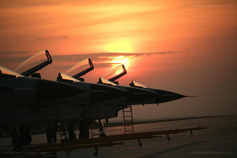 Fighter jets at sunset