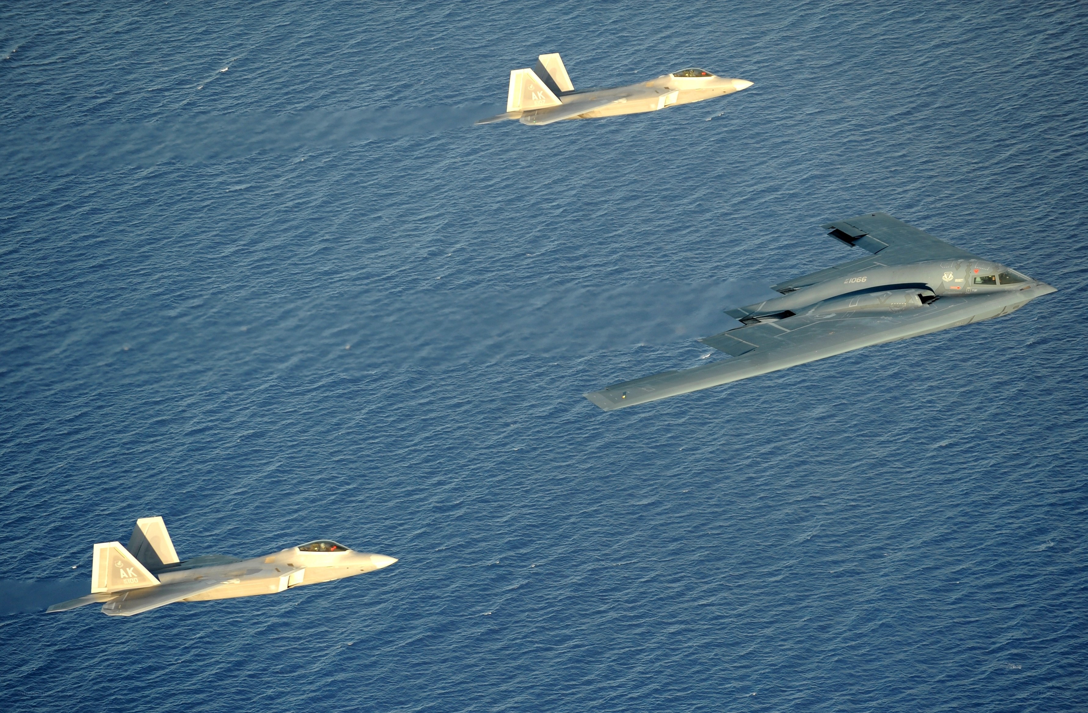 Fighter jets escorting a bomber