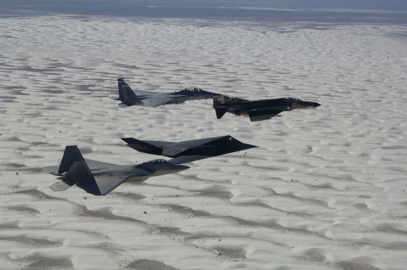 Fighter jets flying over desert