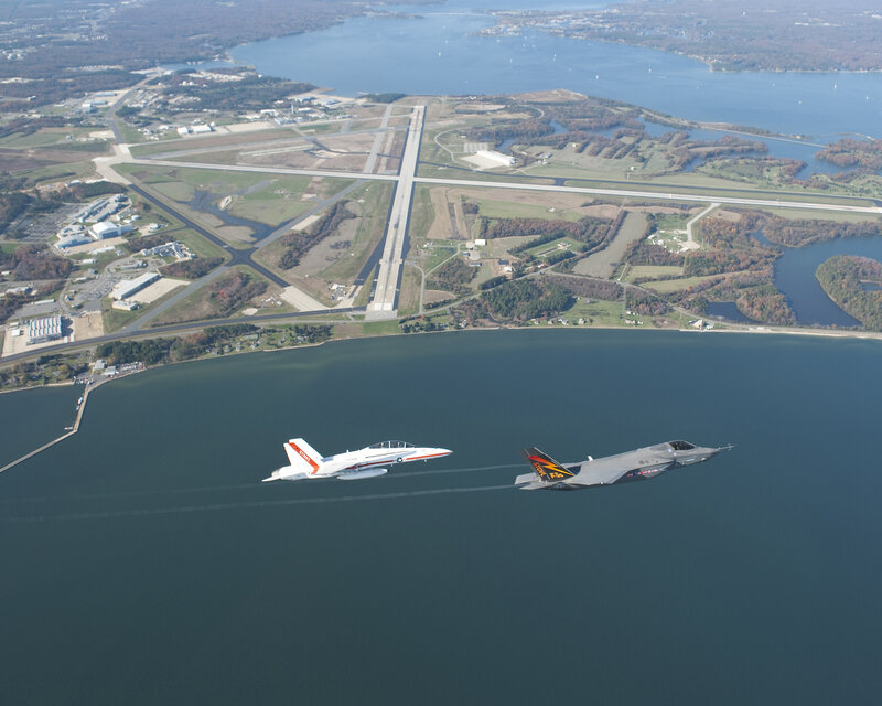 Fighter jets flying over water