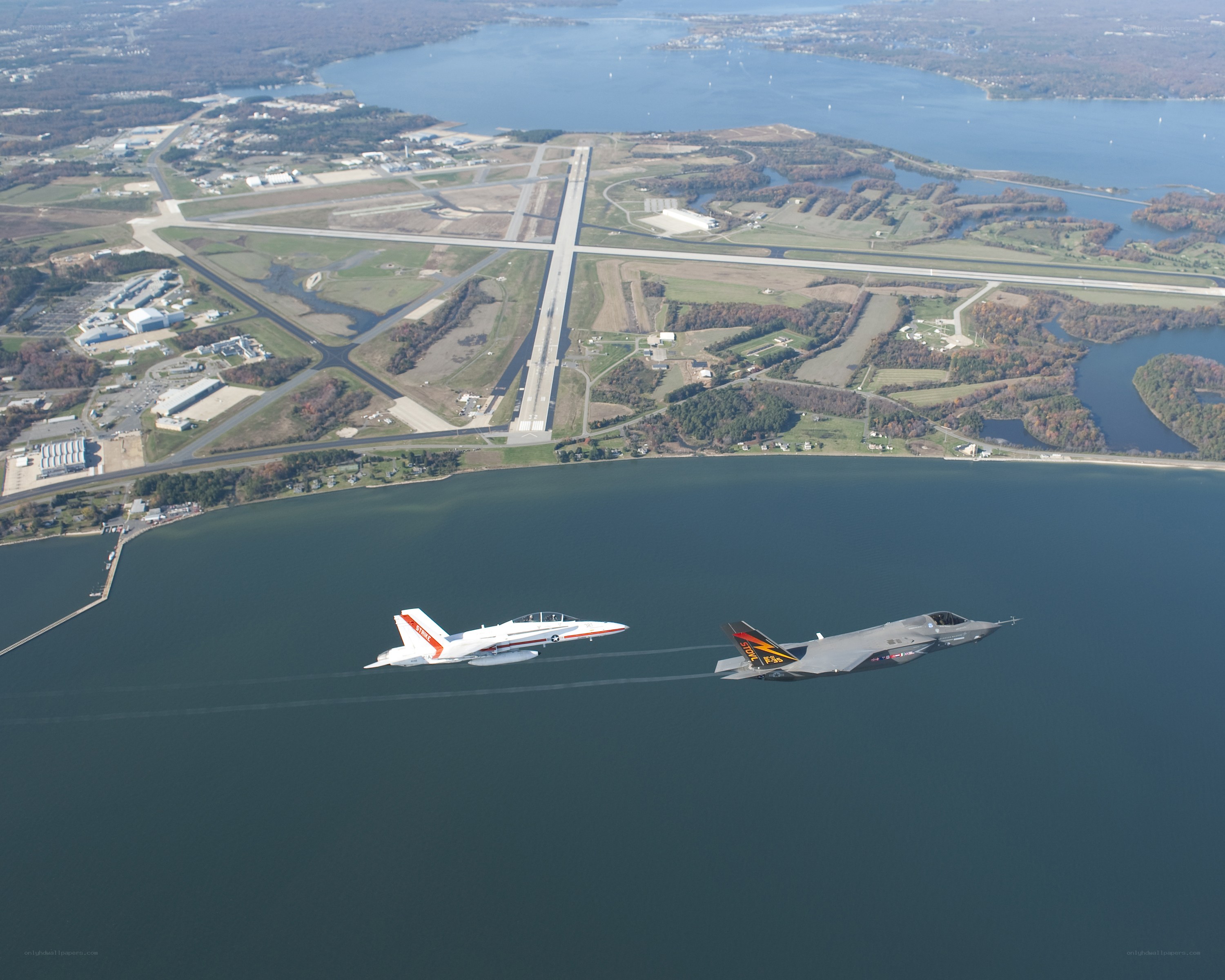 Fighter jets flying over water