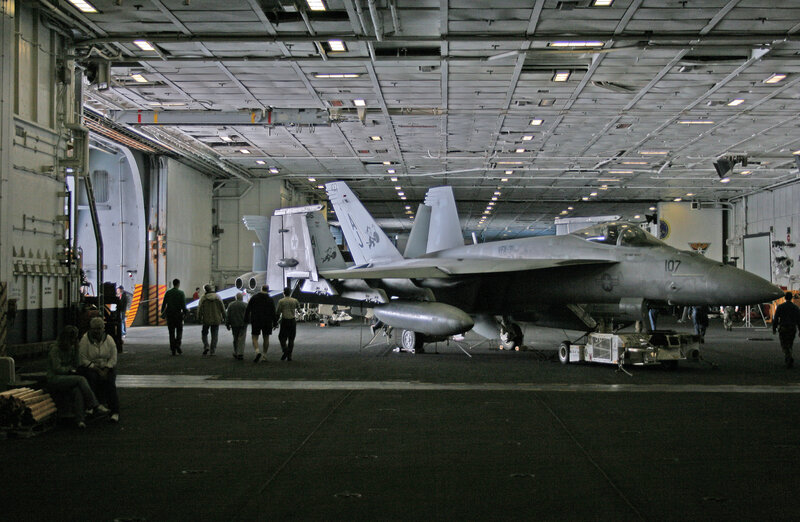 Fighter jets in aircraft carrier hangar