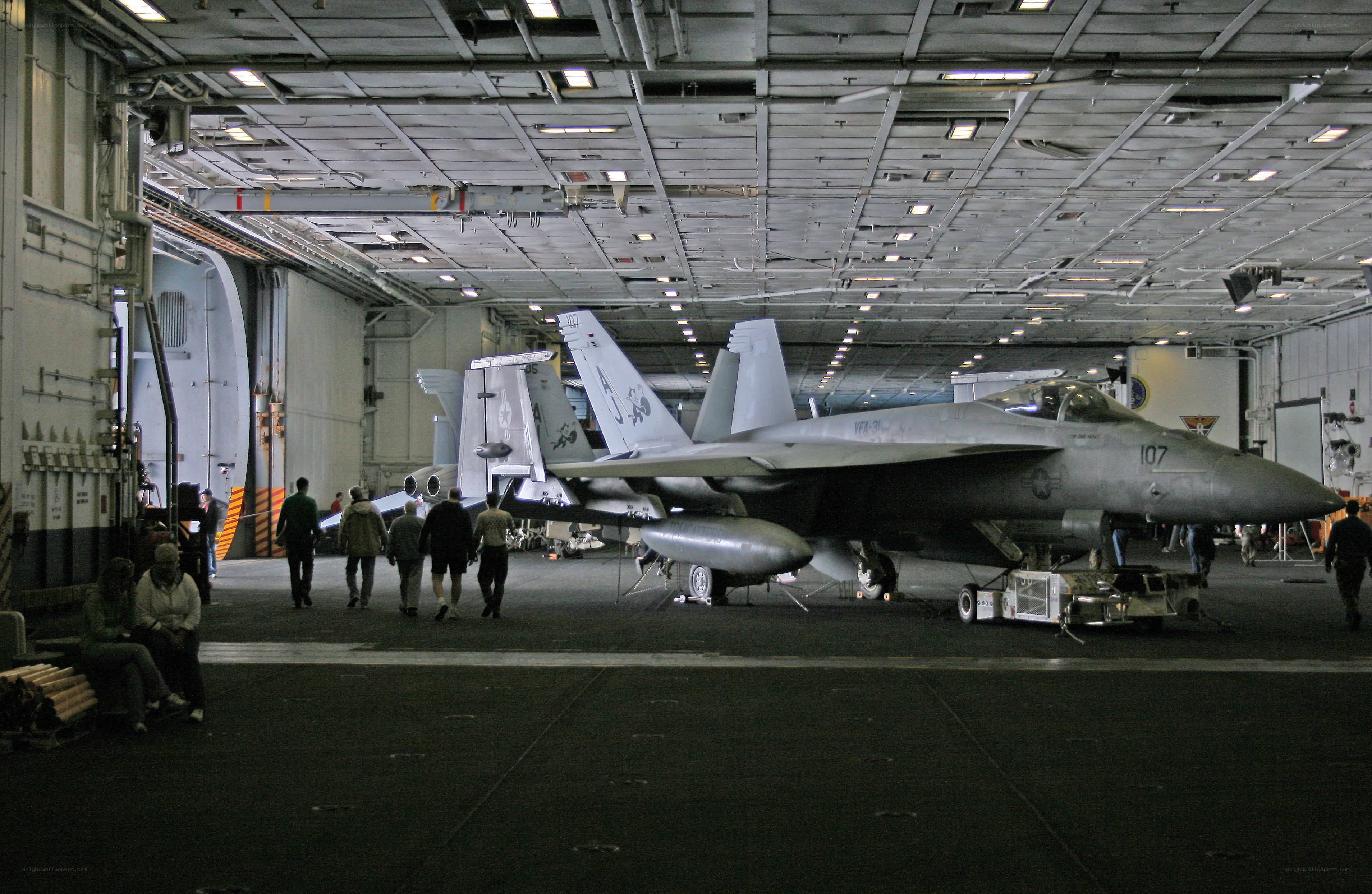Fighter jets in aircraft carrier hangar