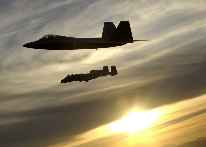 Fighter jets in flight at sunset