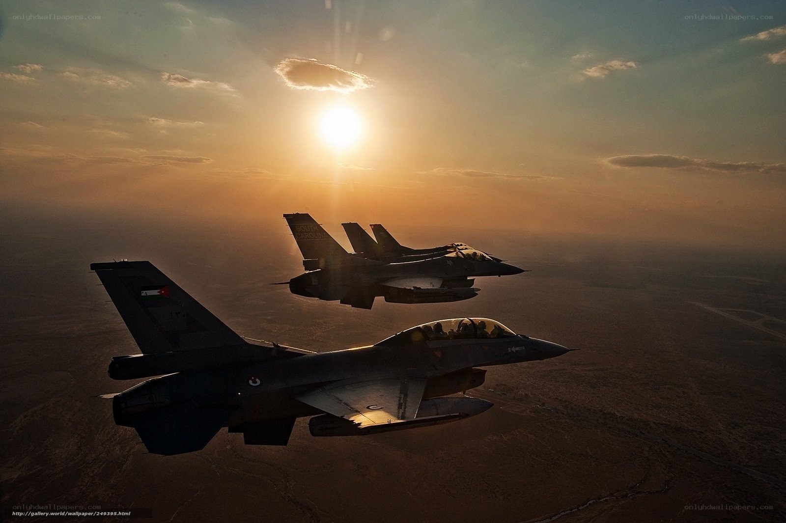 Fighter jets in formation at sunset