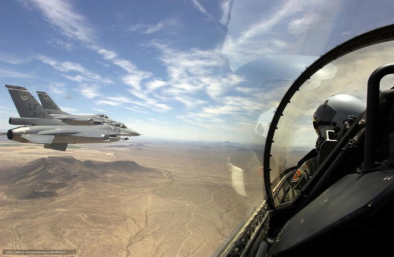 Fighter jets in formation over desert