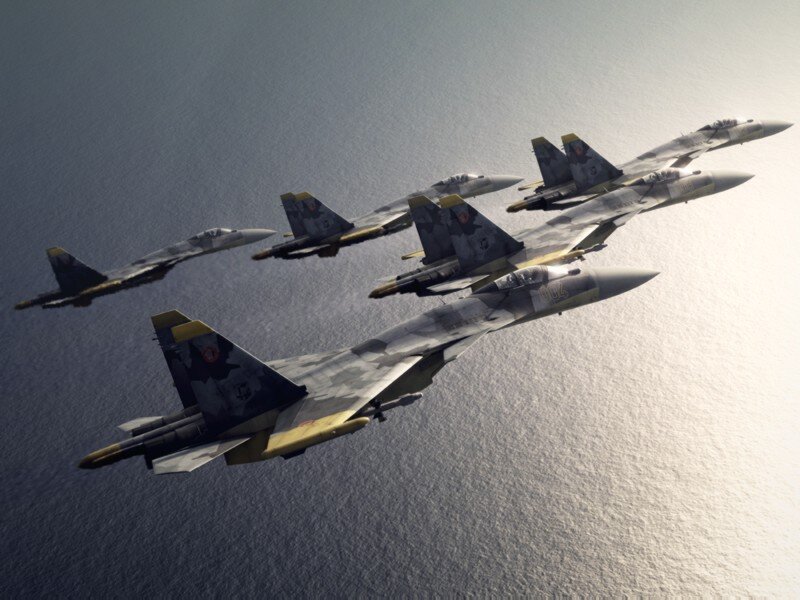 Fighter jets in formation over water