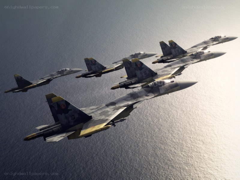 Fighter jets in formation over water