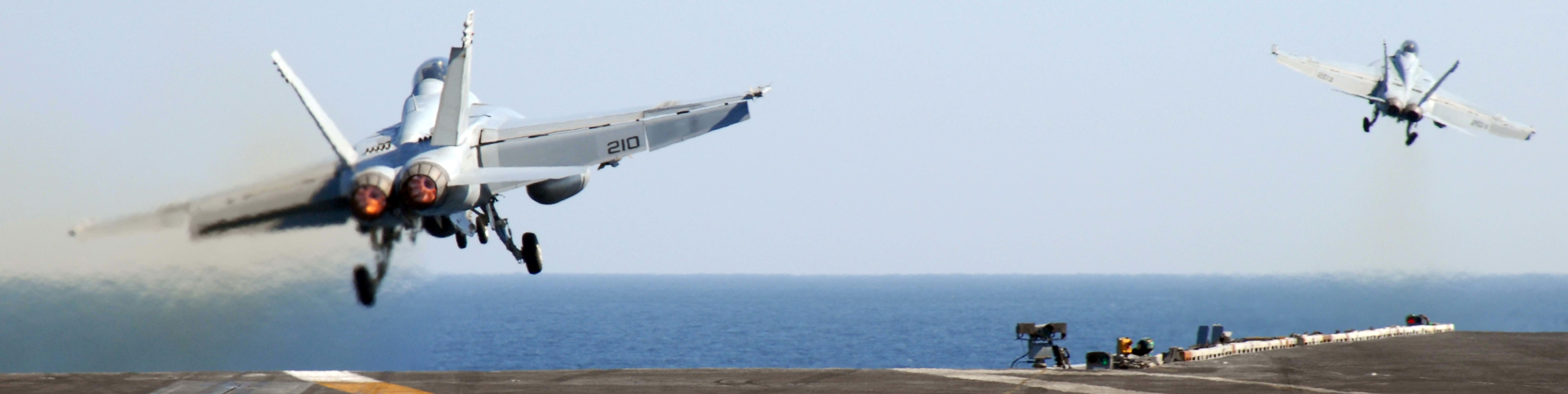 Fighter jets launching from aircraft carrier
