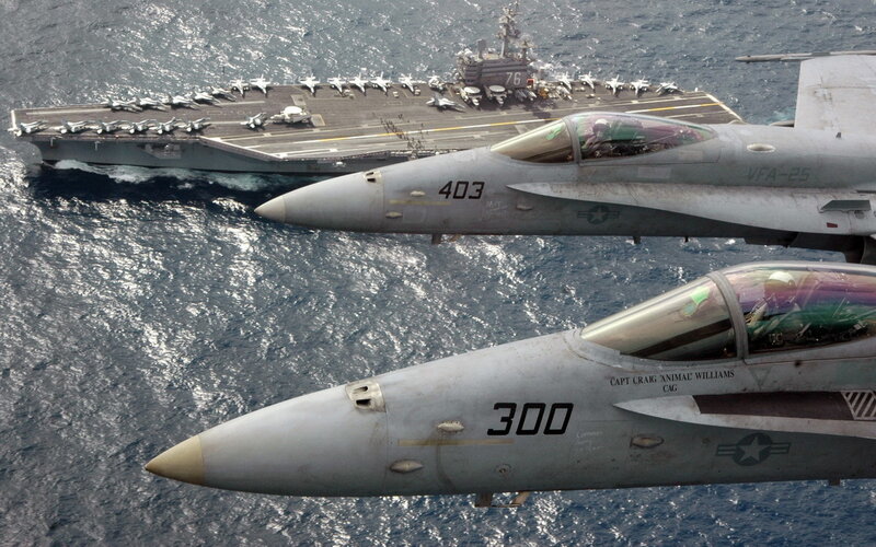 Fighter jets near aircraft carrier