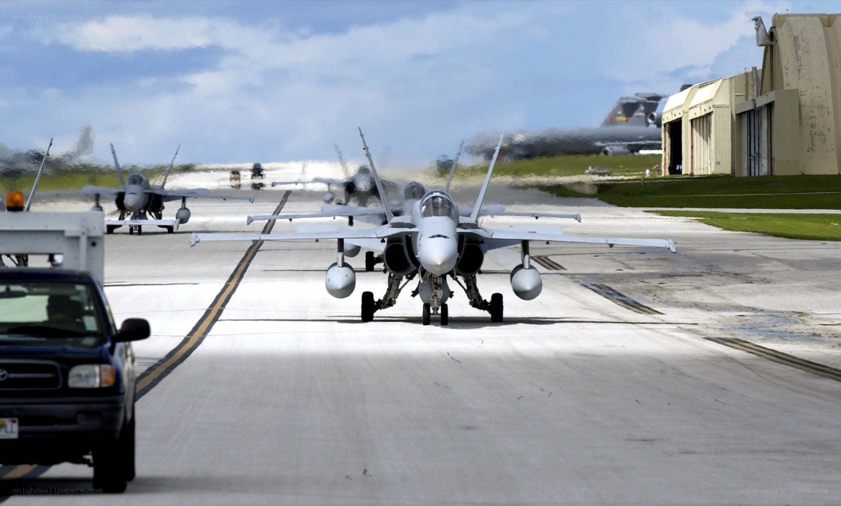 Fighter jets on airfield tarmac