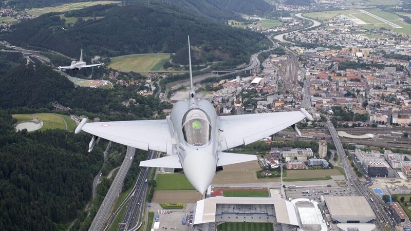Fighter jets over a city