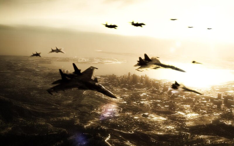 Fighter jets over city at sunset