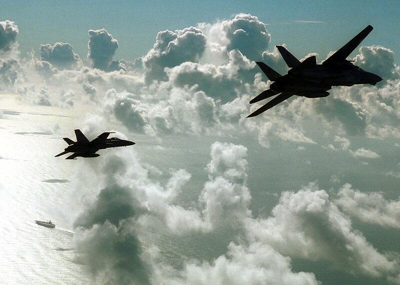 Fighter jets over clouds