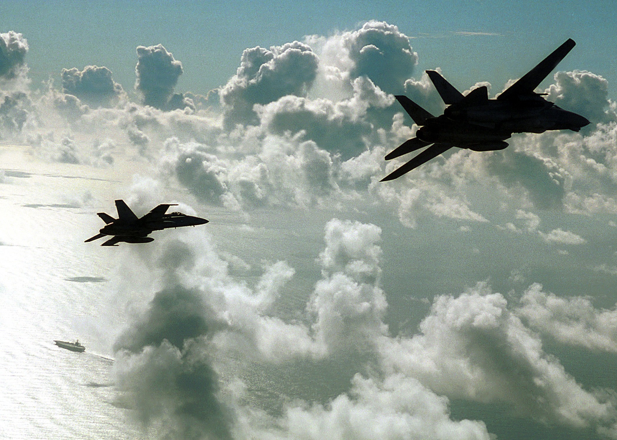 Fighter jets over clouds