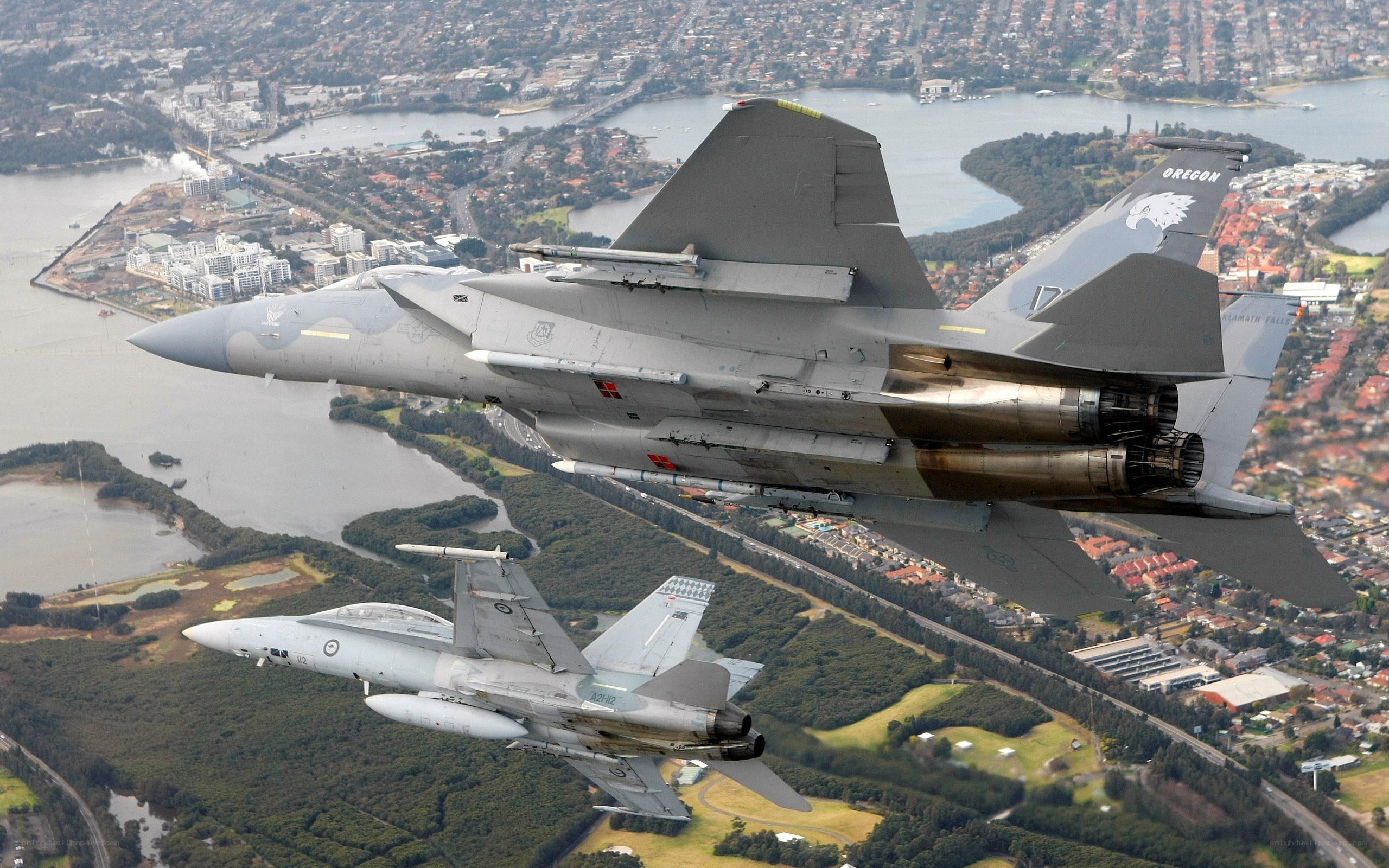 Fighter jets over coastal city