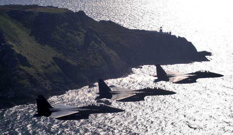 Fighter jets over coastal cliffs