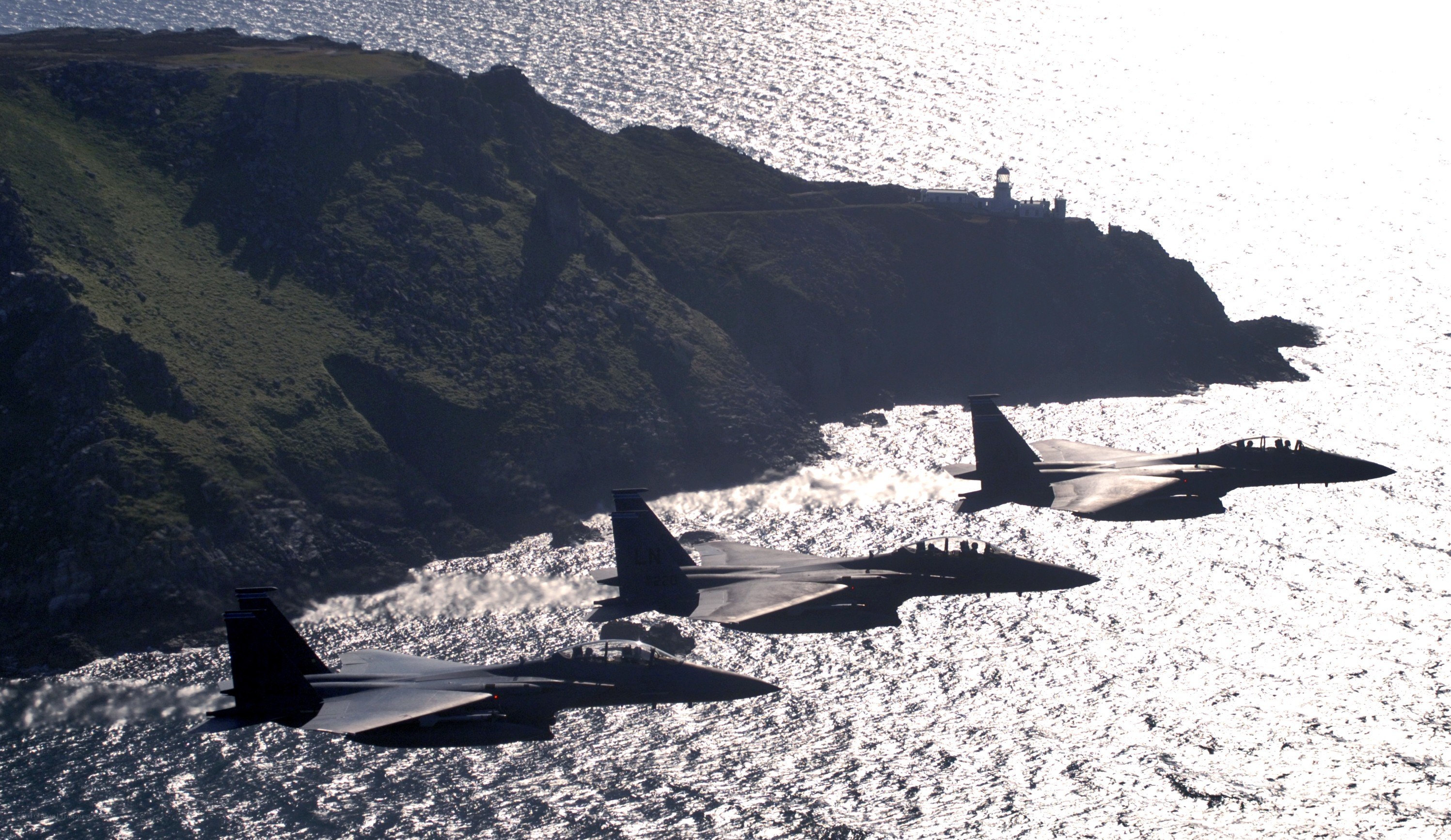 Fighter jets over coastal cliffs